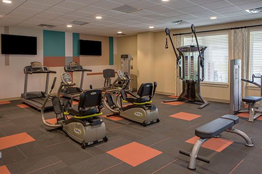 exercise room at The Delaney at Parkway Lakes senior living retirement community