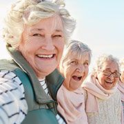 very small size three elderly women having fun at The Delaney at Parkway Lakes retirement community