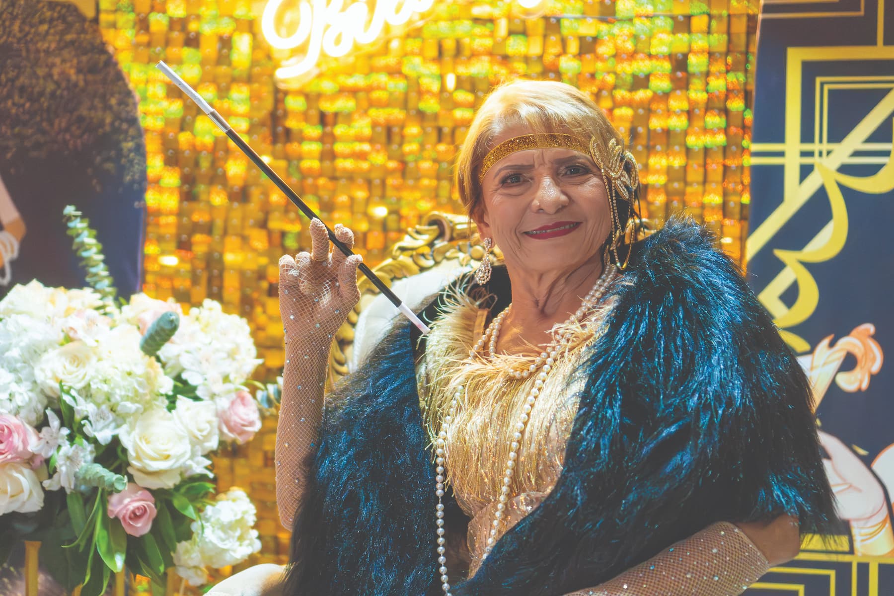 Senior woman in halloween costume posing for fashion show